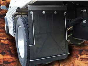 Anti-sail brackets installed behind a truck wheel to prevent debris from getting under the vehicle.